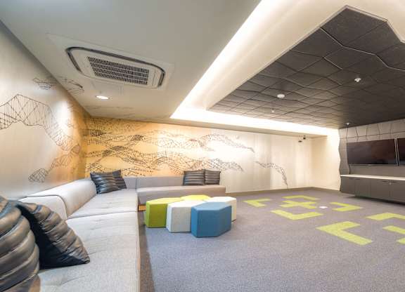 Theatre room with large TV's with large couch seating