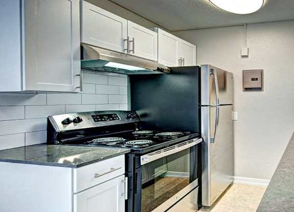 White Kitchen with Stainless Steel  at Lock Vista, Seattle, 98107