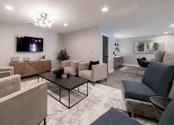 TV room with seating at Governor Square Apartments, Carmel, IN