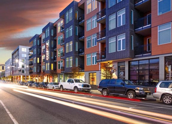 The Wilmore exterior with cars on the road.