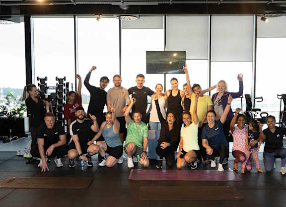 A group of people are posing for a photo in a gym. at Cherrywood Apartments, D18 VY3V