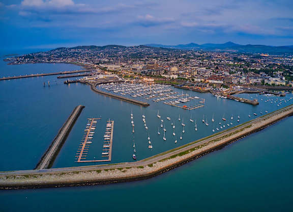 A marina with boats docked in the water and a city in the background. at Cherrywood Apartments, D18 VY3V, DUBLIN 18
