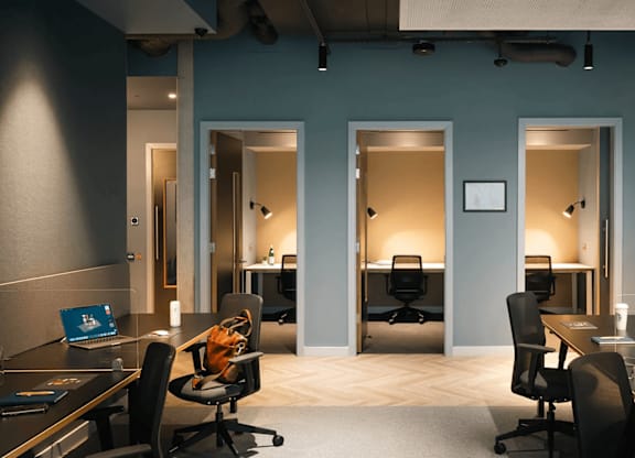 A modern office space with desks, chairs, and computers. at Cherrywood Apartments, D18 VY3V
