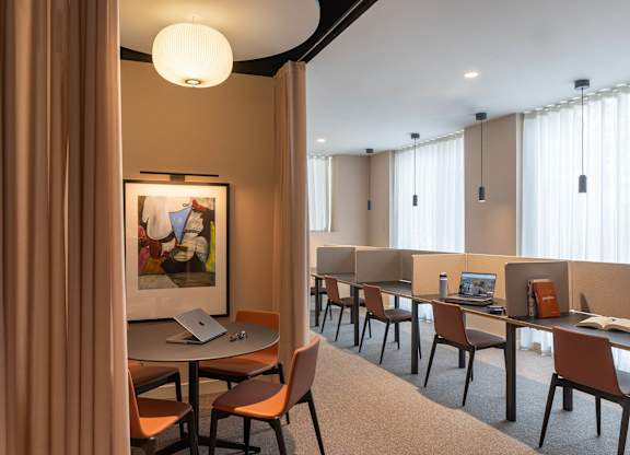 A room with a table and chairs and a painting on the wall at Cherrywood Apartments, D18 VY3V