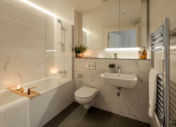 A modern bathroom with a marble tile wall and a white toilet at Cherrywood Apartments, D18 VY3V, DUBLIN 18