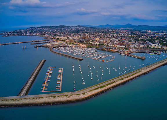 A marina with boats docked in the water and a city in the background at Cherrywood Apartments, D18 VY3V, DUBLIN 18