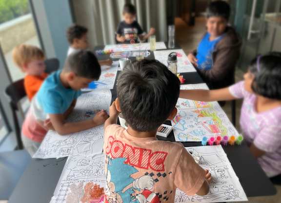 A group of children are sitting around a table drawing at Cherrywood Apartments, D18 VY3V, DUBLIN 18