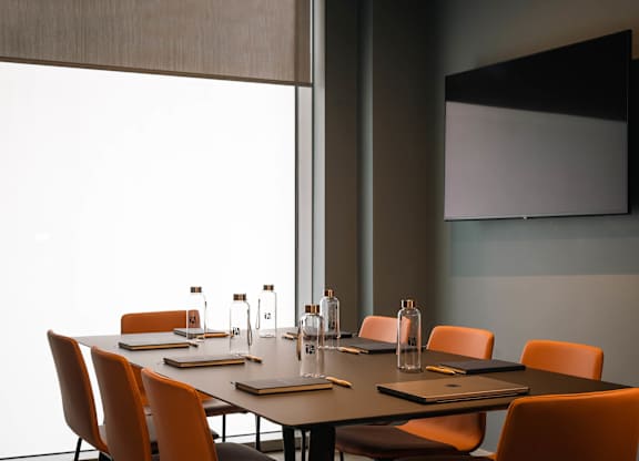 A conference room with a long table and chairs at Cherrywood Apartments, D18 VY3V