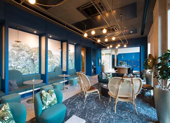 A room with blue walls and furniture.