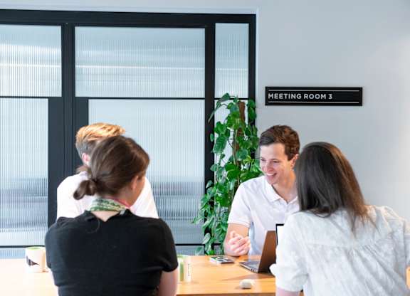 Group of four people in a meeting room at The Lark, London