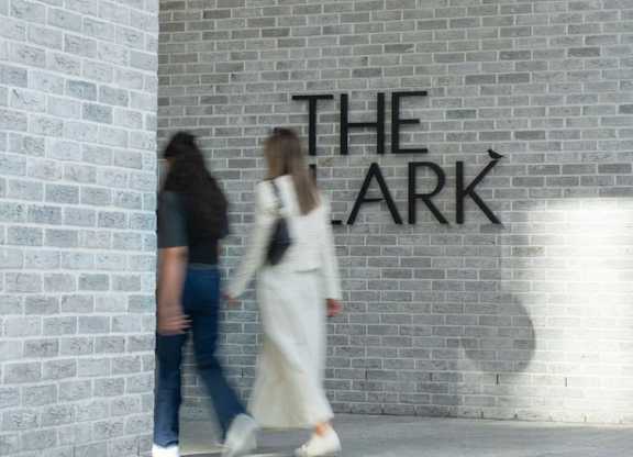 Two people walking towards property entrance at The Lark, London, SW11 7EA
