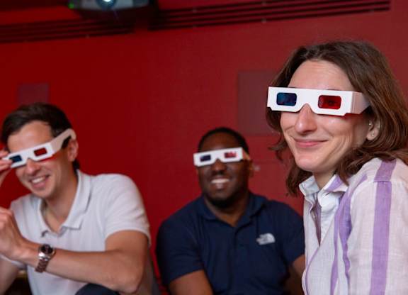 Three people wearing 3D glasses at The Lark, London