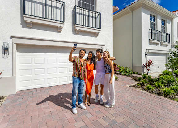 Group of people taking selfie at The Falls of Portofino , Naples, FL