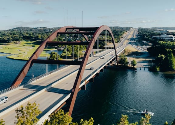 an aerial view of a bridge over a river