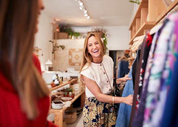 A woman is shopping in a clothing store.