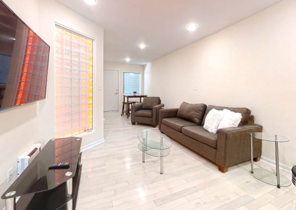 a living room with a couch and a tv