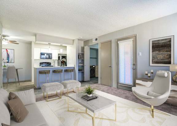 A living room with a white couch and a coffee table.