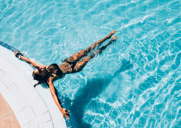a woman floating in a swimming pool