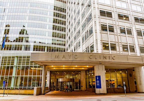 The entrance to the Hayes Clinic is shown with a glass facade building behind it.