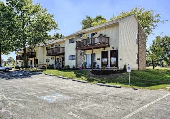 a parking lot in front of an apartment building