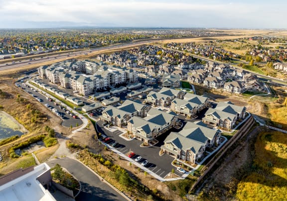 an aerial view of a city with houses and an airport