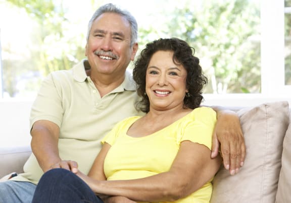 a man and a woman sitting on a couch