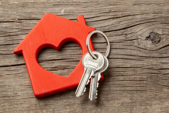 a heart shaped house with a pair of keys