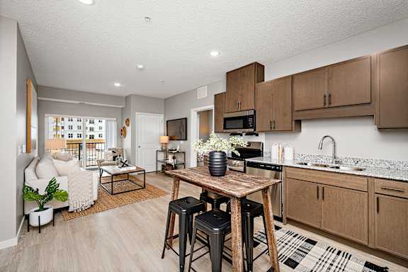 Open concept kitchen with island at Reserve At Settlers Ridge Apartments, Minnesota