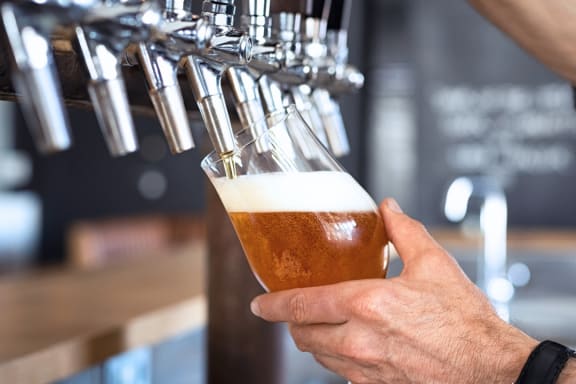 Hand Holding a Beer at Chapel View Apartments in Chapel Hill, NC