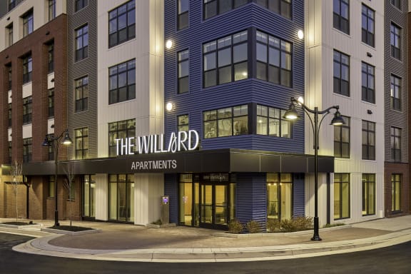 a rendering of a building with a sign that reads the willard apartments