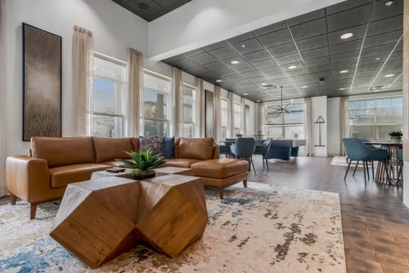 a lobby with couches and chairs and a table at CityView, North Kansas City, 64116