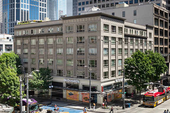 a large building in the middle of a city street