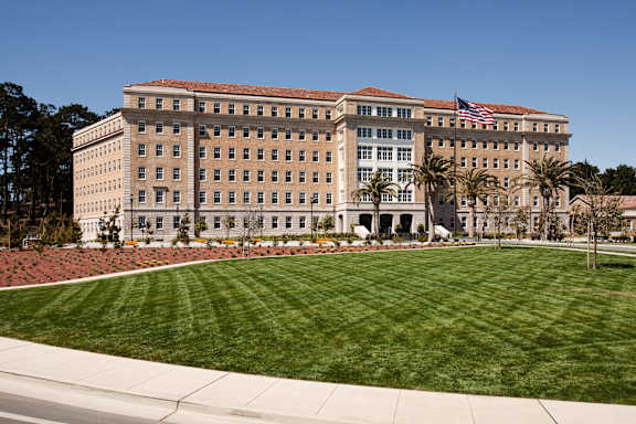 A large building with a flag on the front.