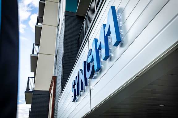 a sign on the side of a building with the name of a hospital
