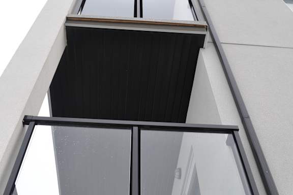 A building with a balcony and a glass railing at The Laurent at Laurel Apartments, Edmonton, AB, T6T 2T5