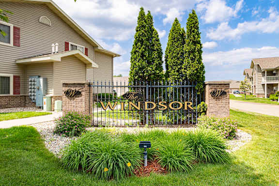 A sign that says "Windsor" is in front of a house.