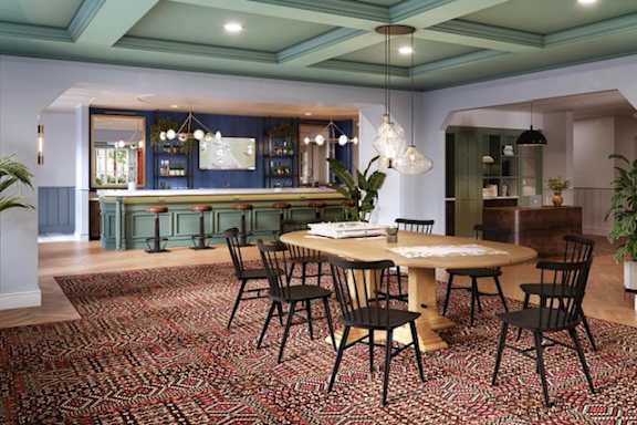 a dining room with a table and chairs
