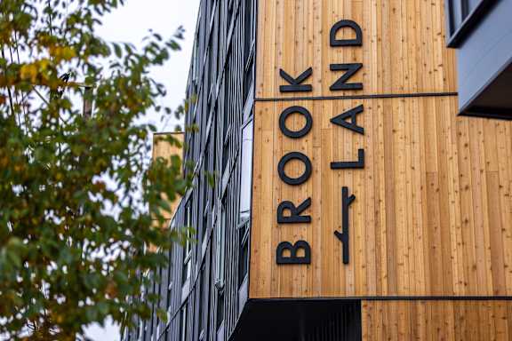 a sign on the side of a building at Brookland Apartments, Oregon