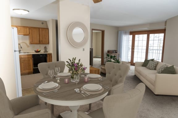 a dining area with a table and chairs and a kitchen in the background  at Briarcliff Apartments, a 55+ Community, Minnesota, 55115