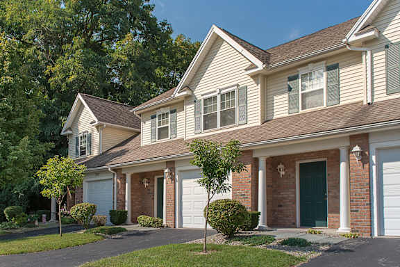 a house with a white garage door in front of it