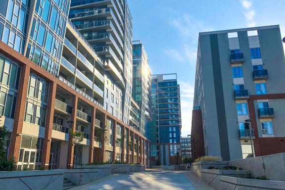 a city street filled with tall buildings and skyscrapers