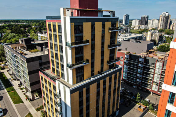 a tall building with a city in the background