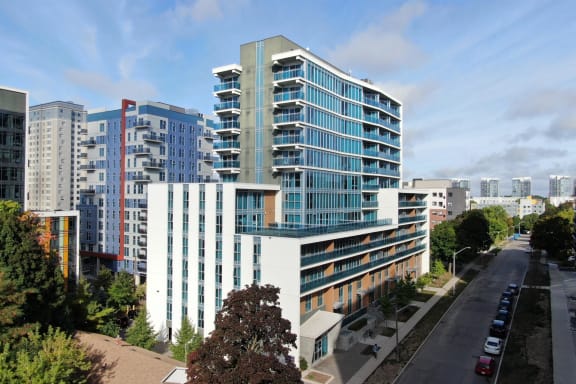 an aerial view of an office building with other buildings in the background