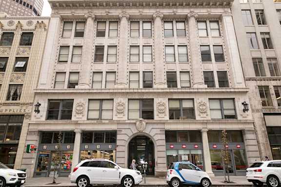 A building with a sign that says "SUPPLIES" on the left side.