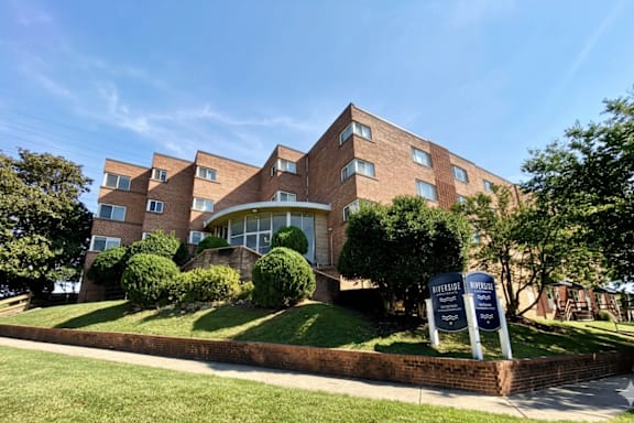 A large brick building with a sign in front that says "Bedford Place".