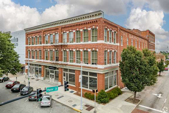 A street view of a red brick building with the sign "The Danner" on it.