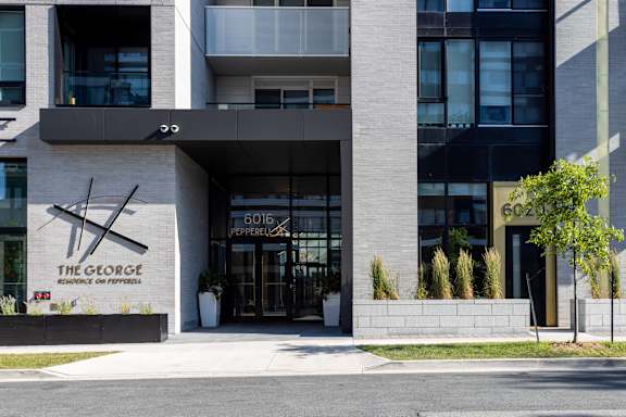 The George Pepperell building has a modern design with a black and white color scheme.