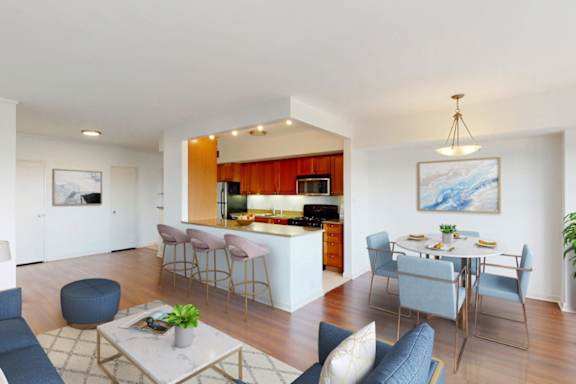 A modern living room with a bar area and a dining table.