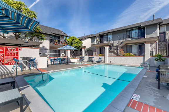 our apartments have a swimming pool and a patio with umbrellas