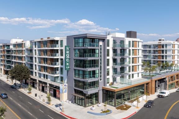 a rendering of an apartment building on a city street